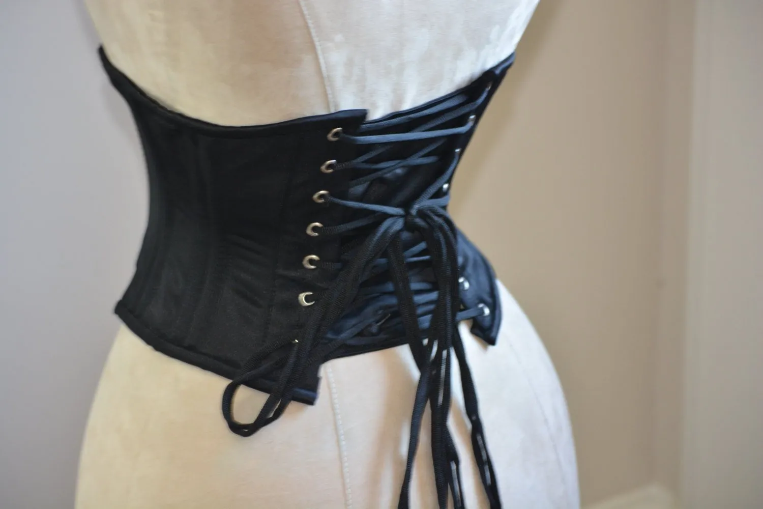 Classic satin steel-boned authentic waspie corset for tight lacing and waist training.